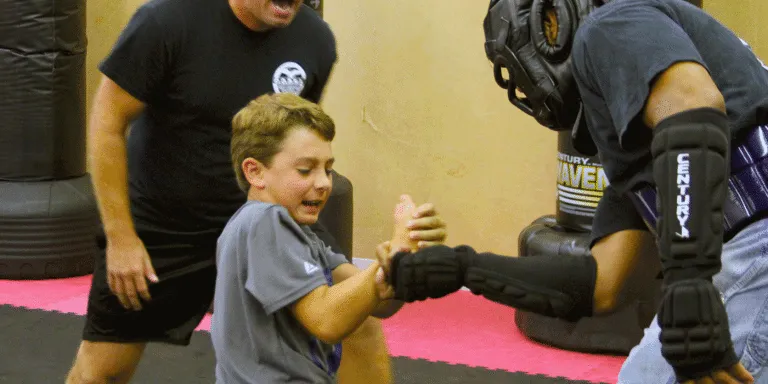 Wrist-Kid-Action-768x384-1 young kid practicing wrist lock escape