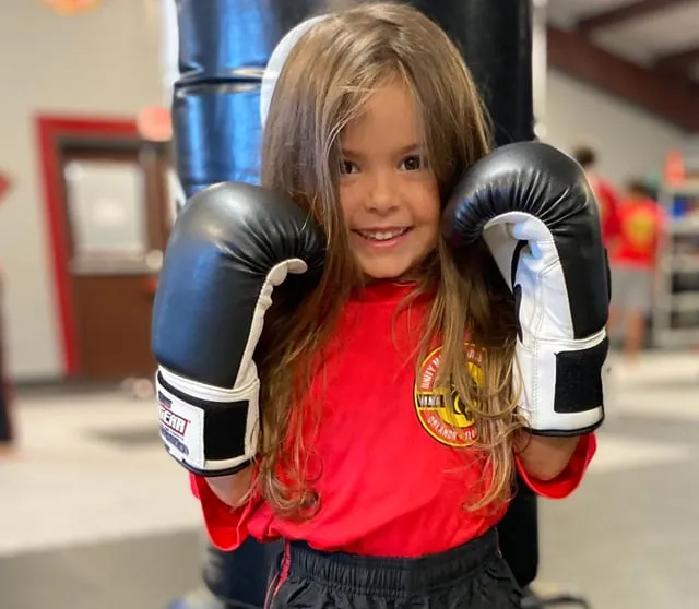 cute young girl in kickboxing pose at Orlando Martial Arts School